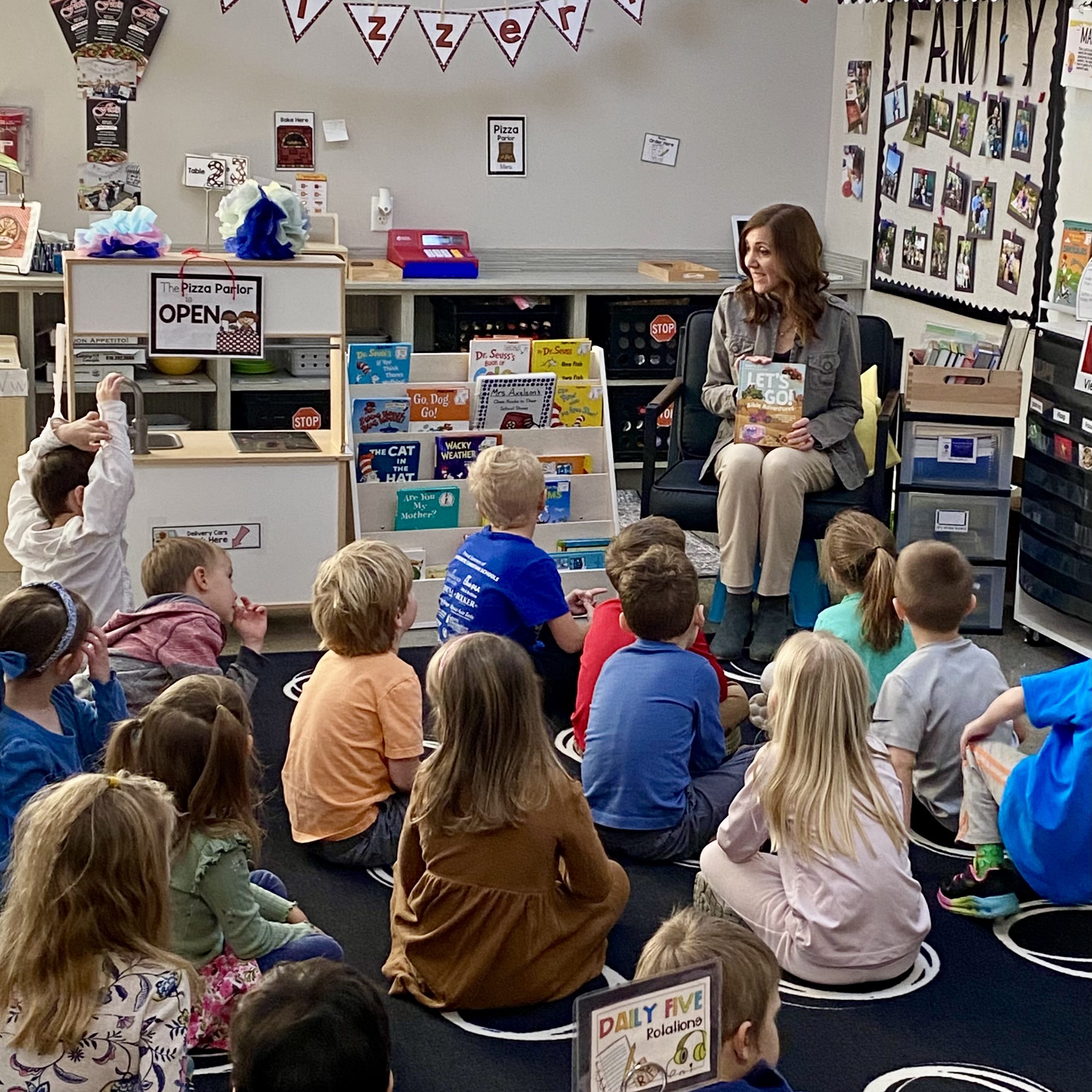 Valerie Ellis sharing Let's Go Bible Adventures storybook Bible in a classroom author visit in Michigan--reading to the kids, sharing biblical truth, and encouraging reading and writing.